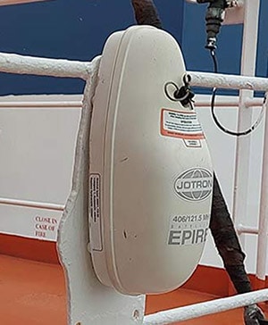 EPRIB in a closed float free container mounted on the railings of a tanker